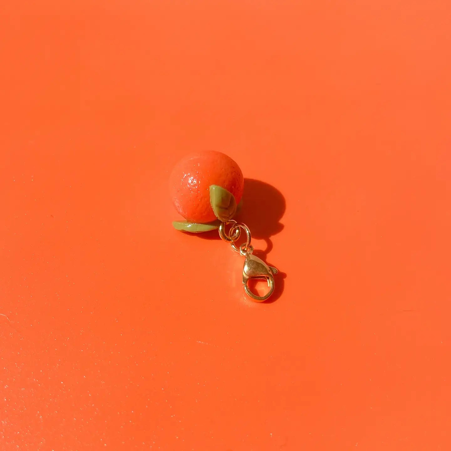 tangerine_bag_charm.webp